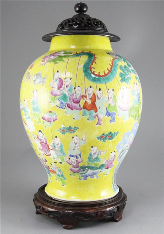 A Chinese yellow ground Hundred Boys jar, 19th century, 49cm including wood stand and cover